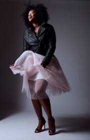 Fashion portrait of Liris Crosse in a dramatic studio look